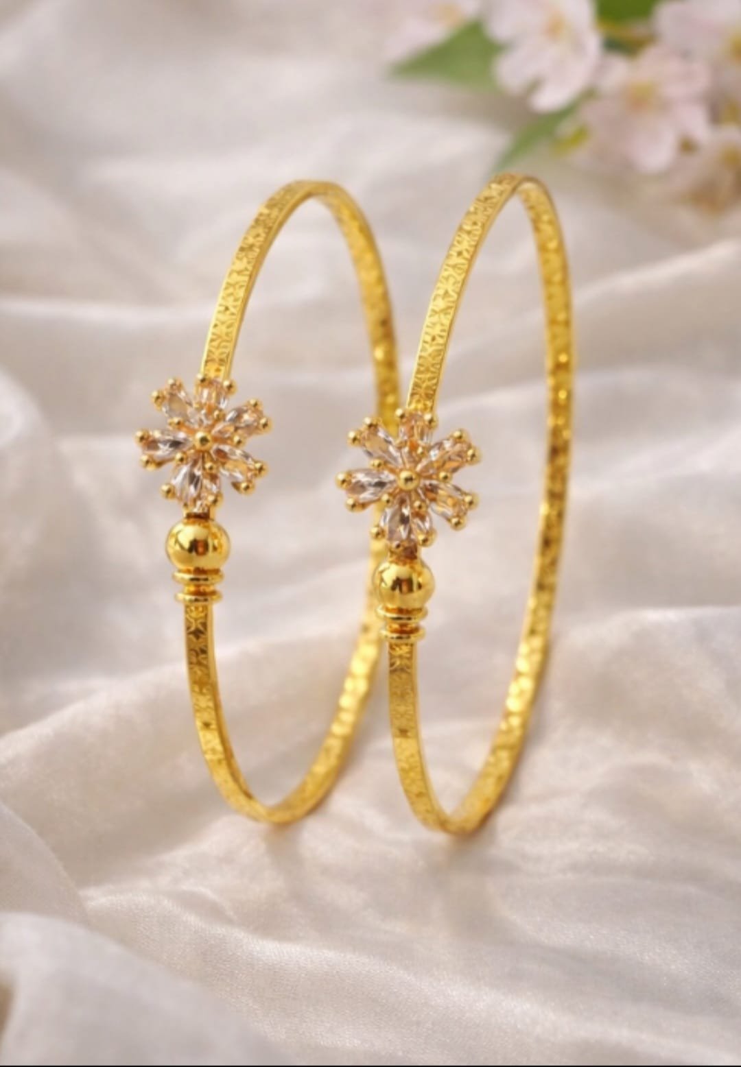 Elegant Two Gold Bangles with Floral Stone Design from Isabel Jewels