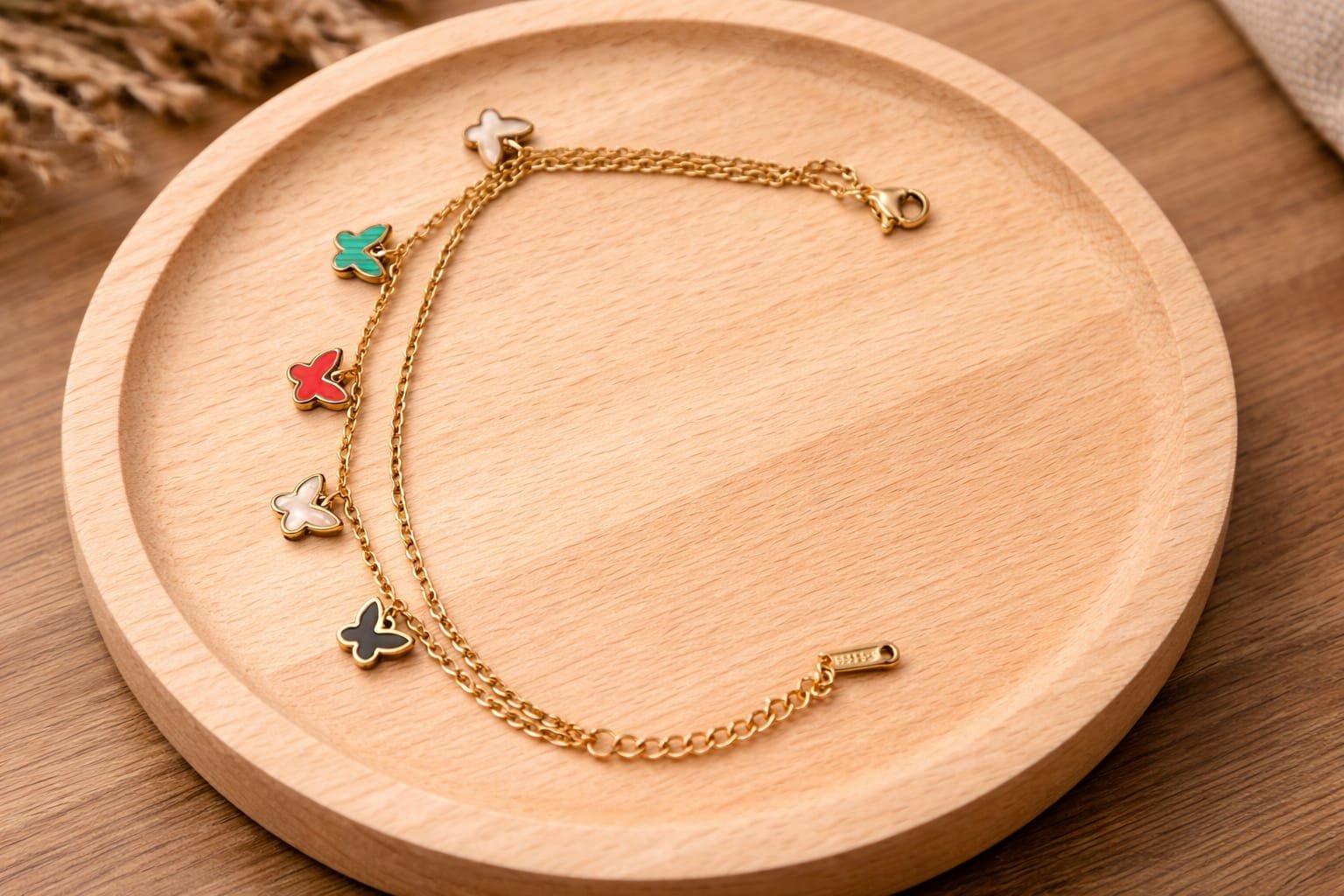 Gold butterfly charm bracelet designed Isabel Jewels